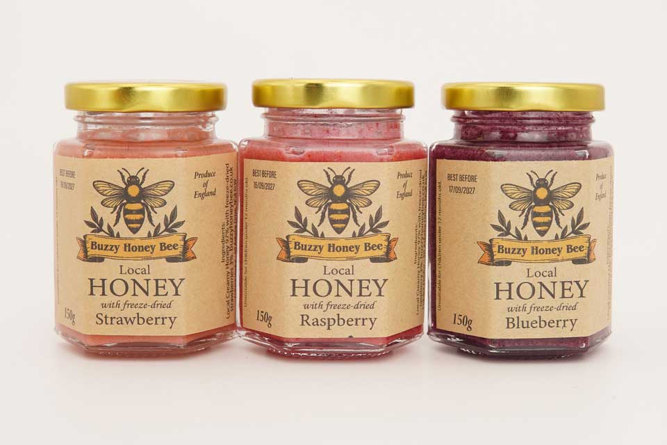 Three 150g jars of fruit-infused honey with freeze-dried strawberry, raspberry and blueberry