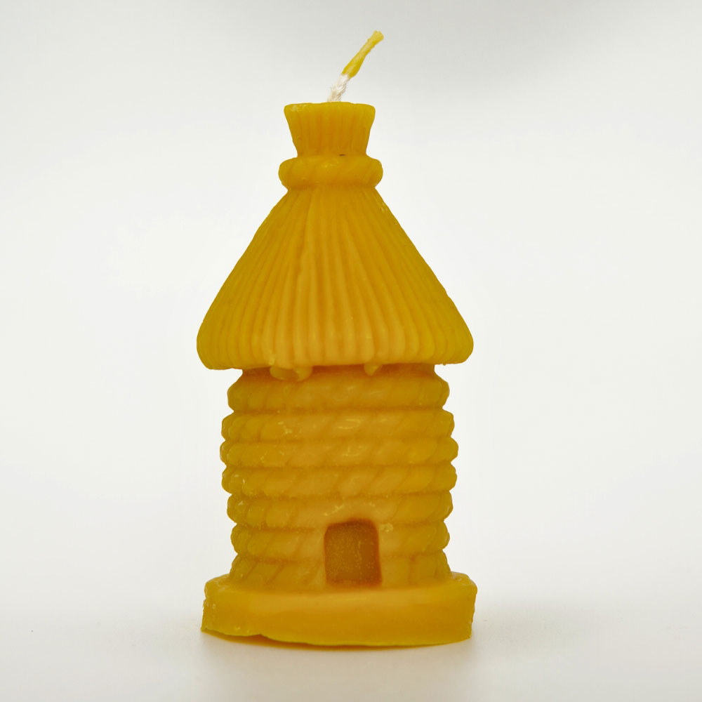 Handcrafted beehive-shaped beeswax candle by Buzzy Honey Bee, Nottingham