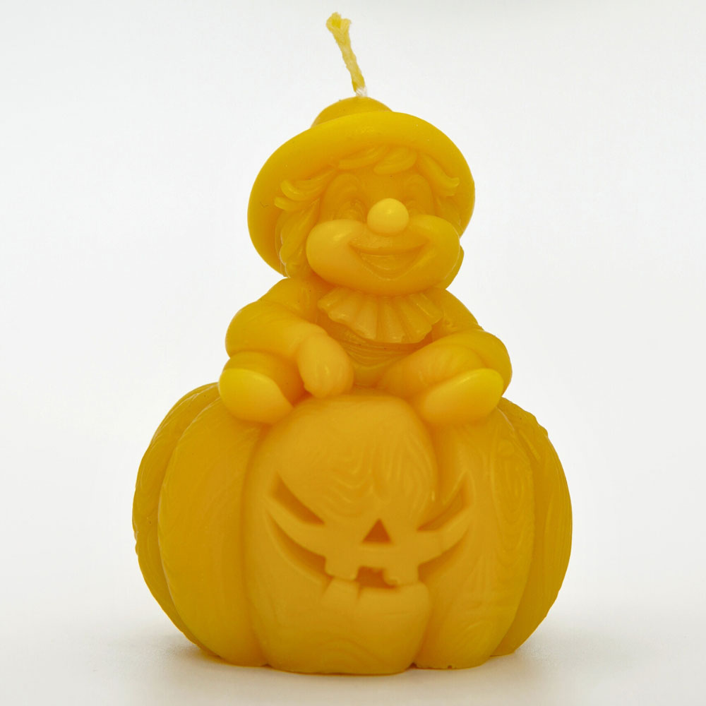 Handmade gnome sitting on pumpkin beeswax candle by Buzzy Honey Bee, Nottingham