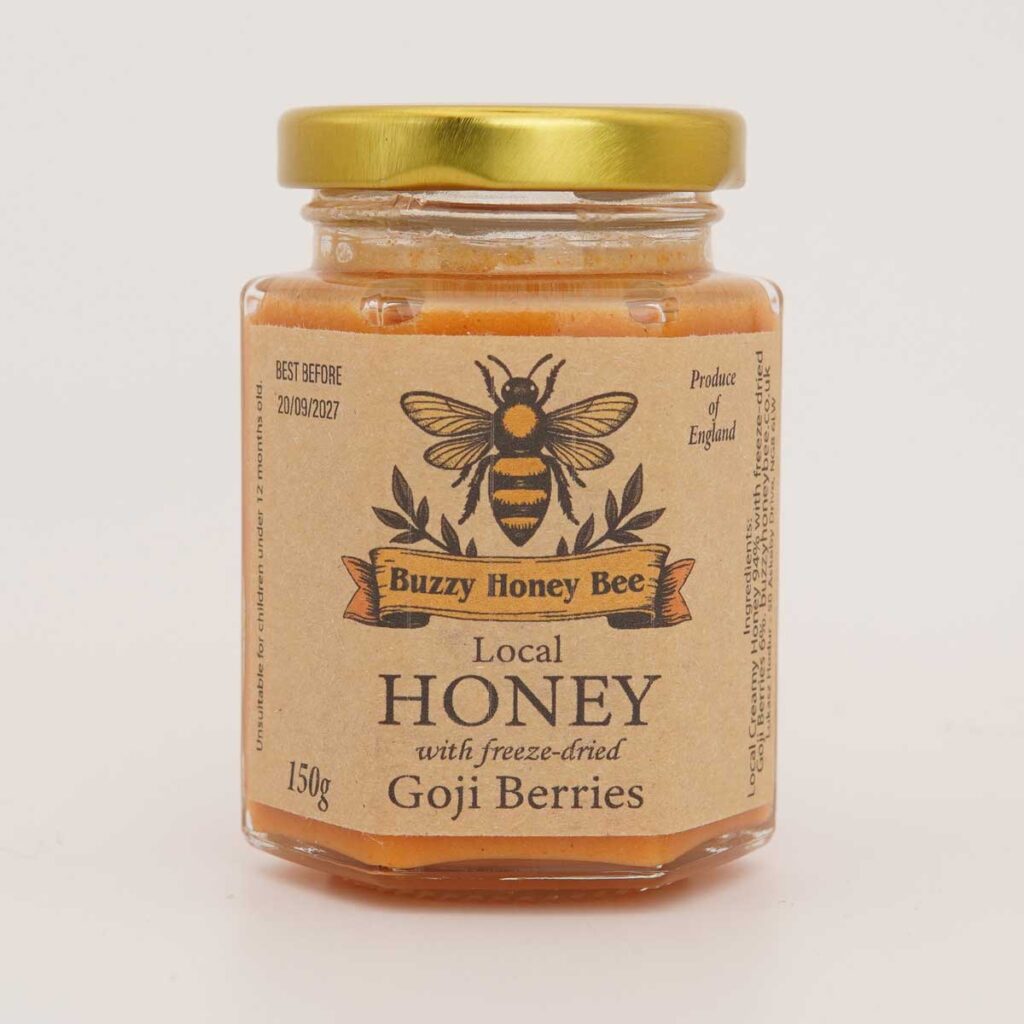 150g hex jar of honey with goji berries, gold lid, on a white background